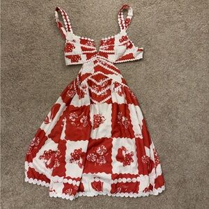 This is a really cute red and white dress. It is a size medium.